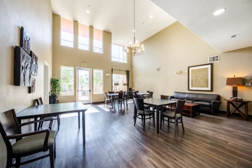 spacious community room with dining tables