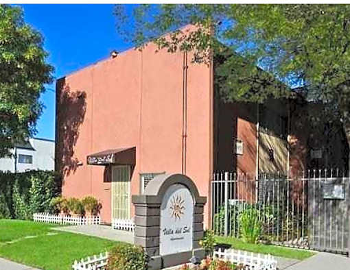 A building with a sign that says "Pine View" in front of it.