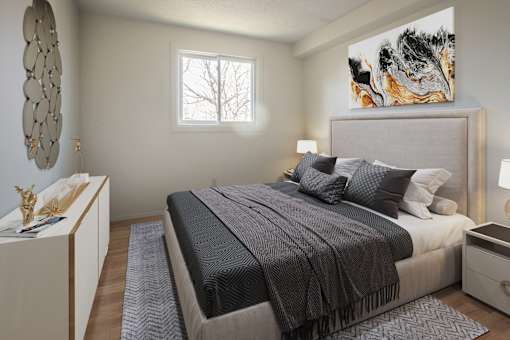 A bedroom with a large bed and a painting on the wall.