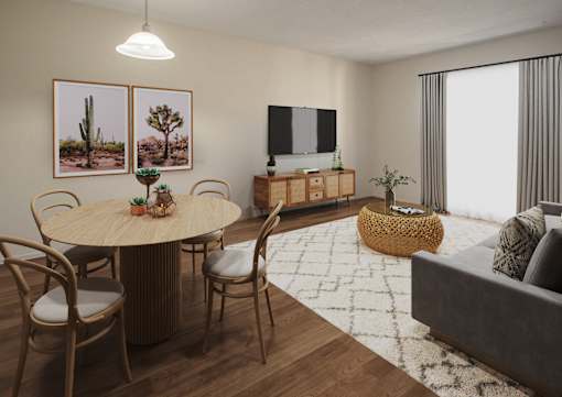 A living room with a round table surrounded by chairs and a flat screen TV mounted on the wall.