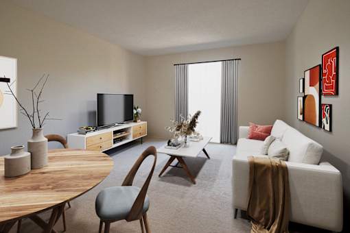 A living room with a white couch, a wooden table, and a television.