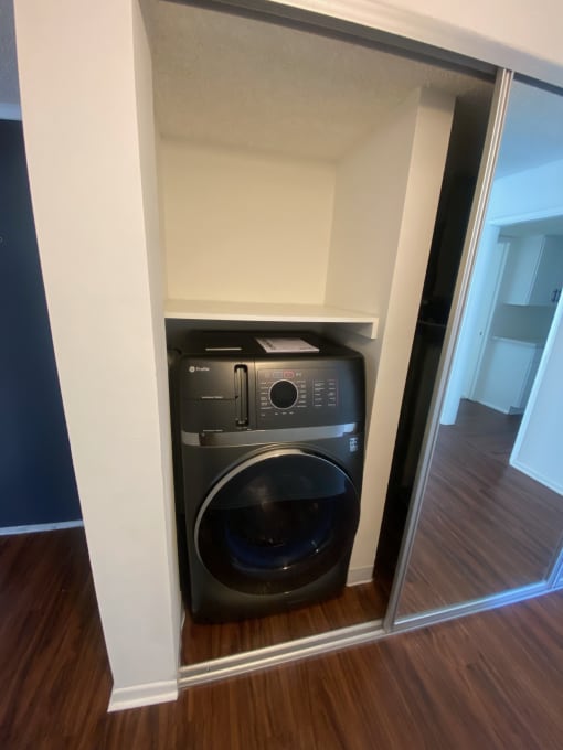 a washing machine and dryer in a closet