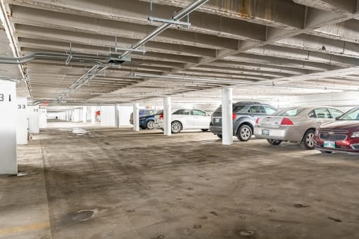 a parking garage with cars in it