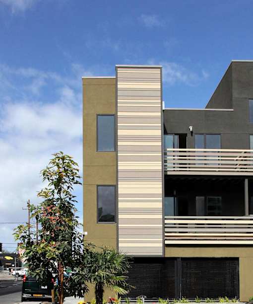 A modern building with a tree in front of it.