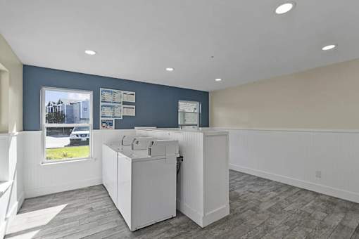 A kitchen area with a window and a sink.