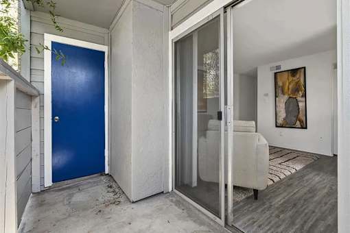 A blue door is on the left and a glass door is on the right.