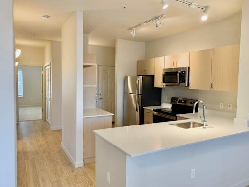 Kitchen with white countertops at Wilsonville Summit Apartments, Oregon , 97070