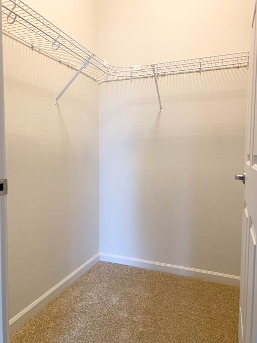 White closet at Wilsonville Summit Apartments, Wilsonville 