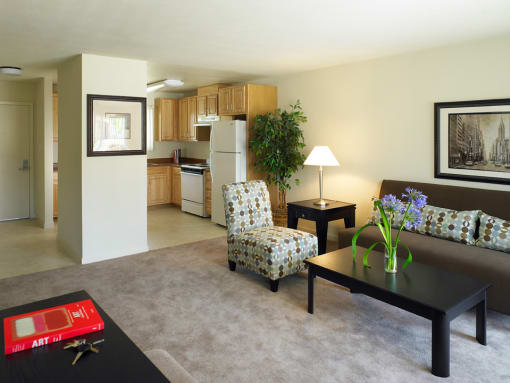 a living room with a couch a chair and a table