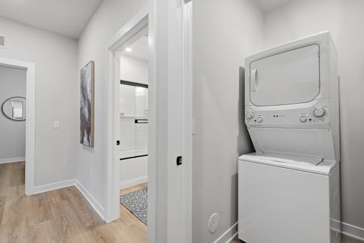 A white washing machine in a laundry room.