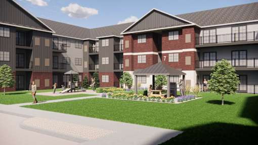 A rendering of a multi-story apartment complex with a courtyard in the center.