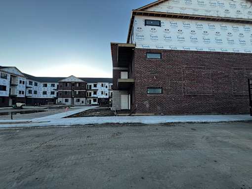 A building under construction with Tyvek branded insulation on the roof.
