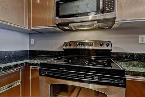 A black stove top oven with a digital display in the middle.