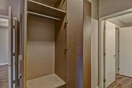 A room with a closet and a door.