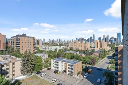 the view of the city from the balcony of a building