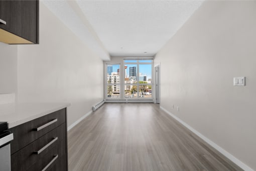 the living room of a condo with a view of the city