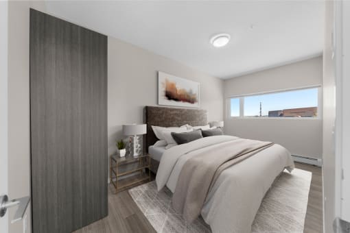 an image of a bedroom with a bed and a window