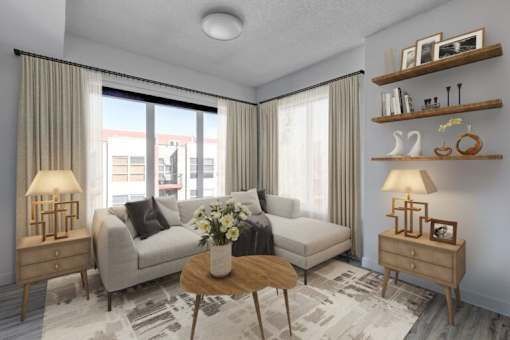 A living room with a couch, a table, and a window with curtains.