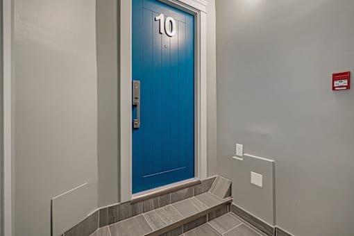 A blue door with the number 10 on it.