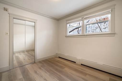 A room with a sliding door and a window.