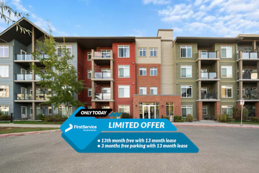 A building with a sign offering a 13th month free with a 13 month lease and 3 months free parking with a 13 month lease.