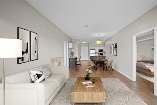 a living room and dining room with a couch and a table