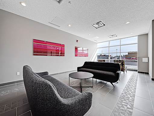A modern waiting room with a view of the city.