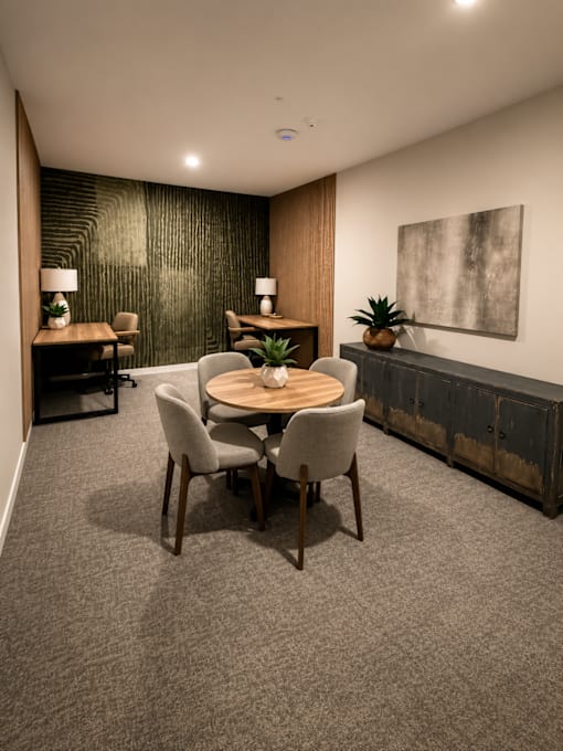 Modern business center with coworking desks, collaborative seating, private workstations, and contemporary finishes at 200 Main Kannapolis.