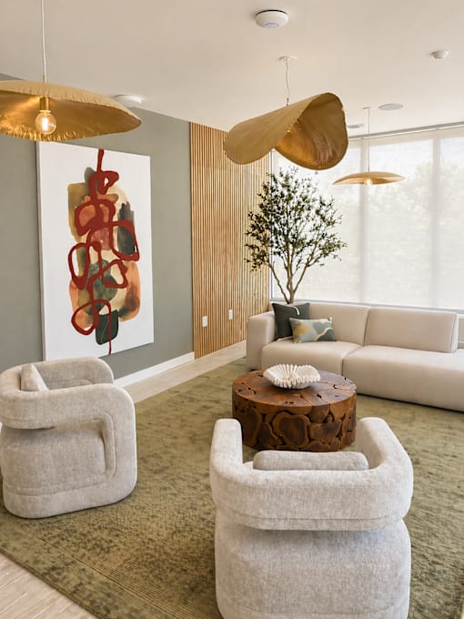Welcoming lobby entrance at 200 Main Kannapolis featuring designer seating, contemporary artwork, and luxury apartment interiors.