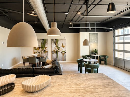 Spacious resident clubhouse lounge at 200 Main Kannapolis featuring modern seating, coworking areas, and upscale interior design.