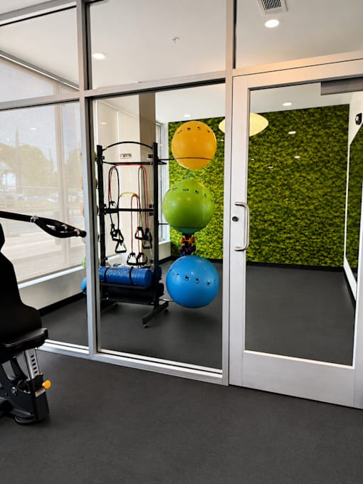 Dedicated yoga and wellness studio at 200 Main Kannapolis with fitness equipment, open workout space, and modern design.