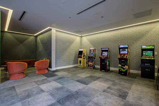 Expansive arcade game area at The Rail in Bound Brook with retro favorites and plush seating in Bound Brook, NJ.