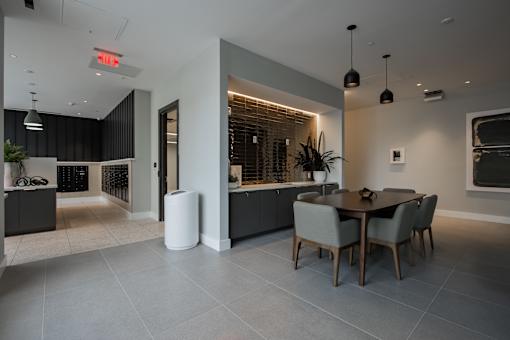 A luxury lobby with a dining table and chairs at The Rail at Bound Brook, NJ.