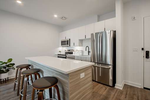 Luxury kitchen island and barstool seating in a luxury apartment at The Rail at Bound Brook, NJ.