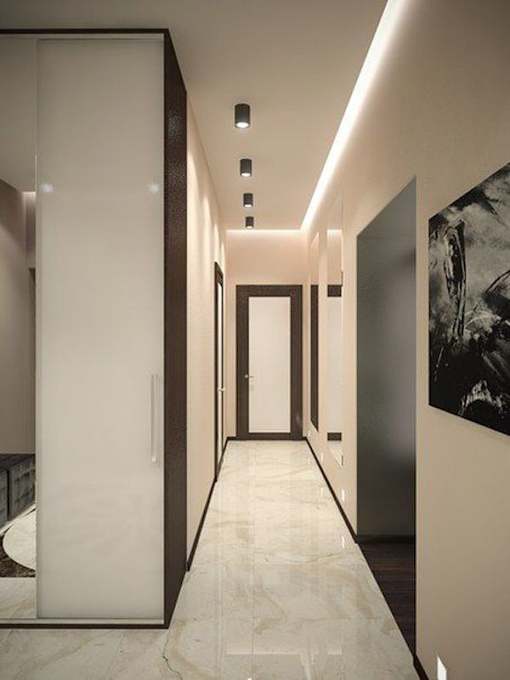 a long hallway with doors and a painting on the wall