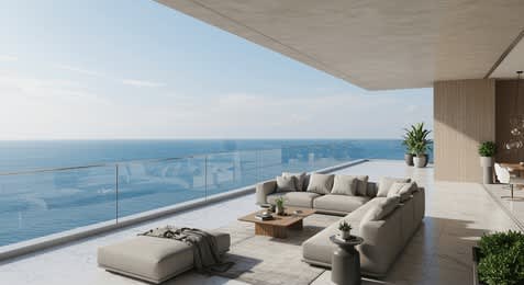 A modern living room with a view of the ocean.