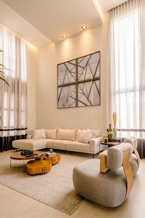 a living room filled with furniture and a large window
