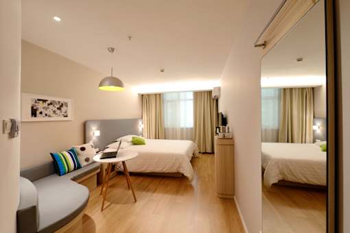Master bedroom with queen beds and a desk