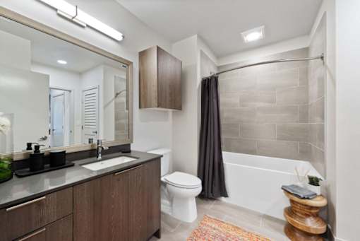 a bathroom with a sink toilet and bathtub