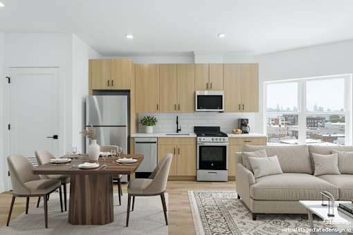 A modern kitchen with a dining table set for four.