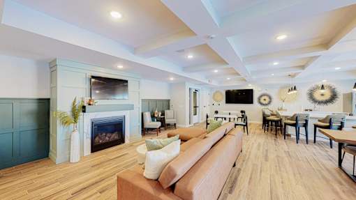 A living room with a fireplace and a couch.