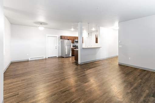 A kitchen area with a refrigerator, microwave, and oven.at The Brix Apartments, Spokane Valley, 99037