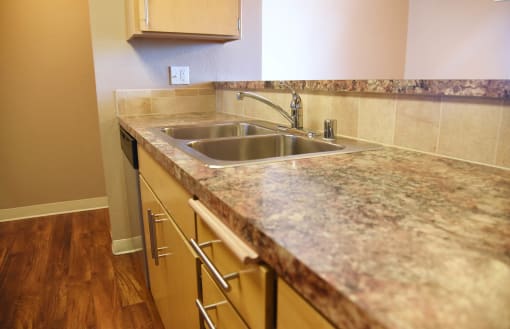 Kitchen gallery with granite marble table top at Graymayre Crossing Apartments, Spokane, 99208