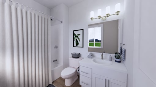 A white bathroom with a toilet, sink, and shower curtain.