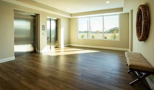 A room with a wooden floor and a bench.