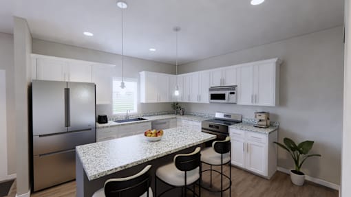 A modern kitchen with a granite countertop and stainless steel appliances.