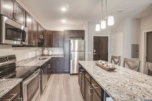 Warm Tone Kitchen, new, granite, lux, Senior Apartment, Senior living, Maplewood, White Bear Lake, Saint Paul, Frost English Silver