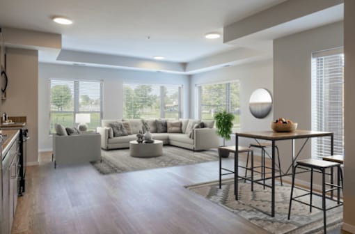A modern living room with a large sectional sofa and a coffee table.