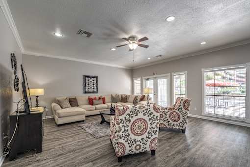 A living room with a patterned sofa and a television.
