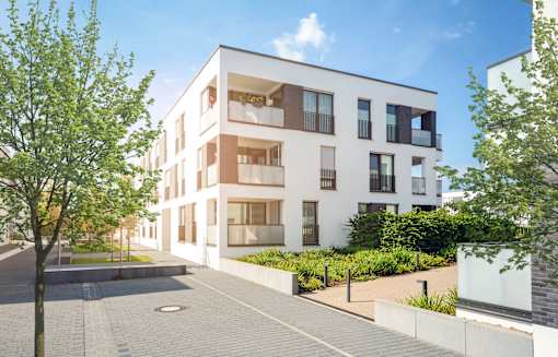 A modern white apartment building with balconies and trees in front.